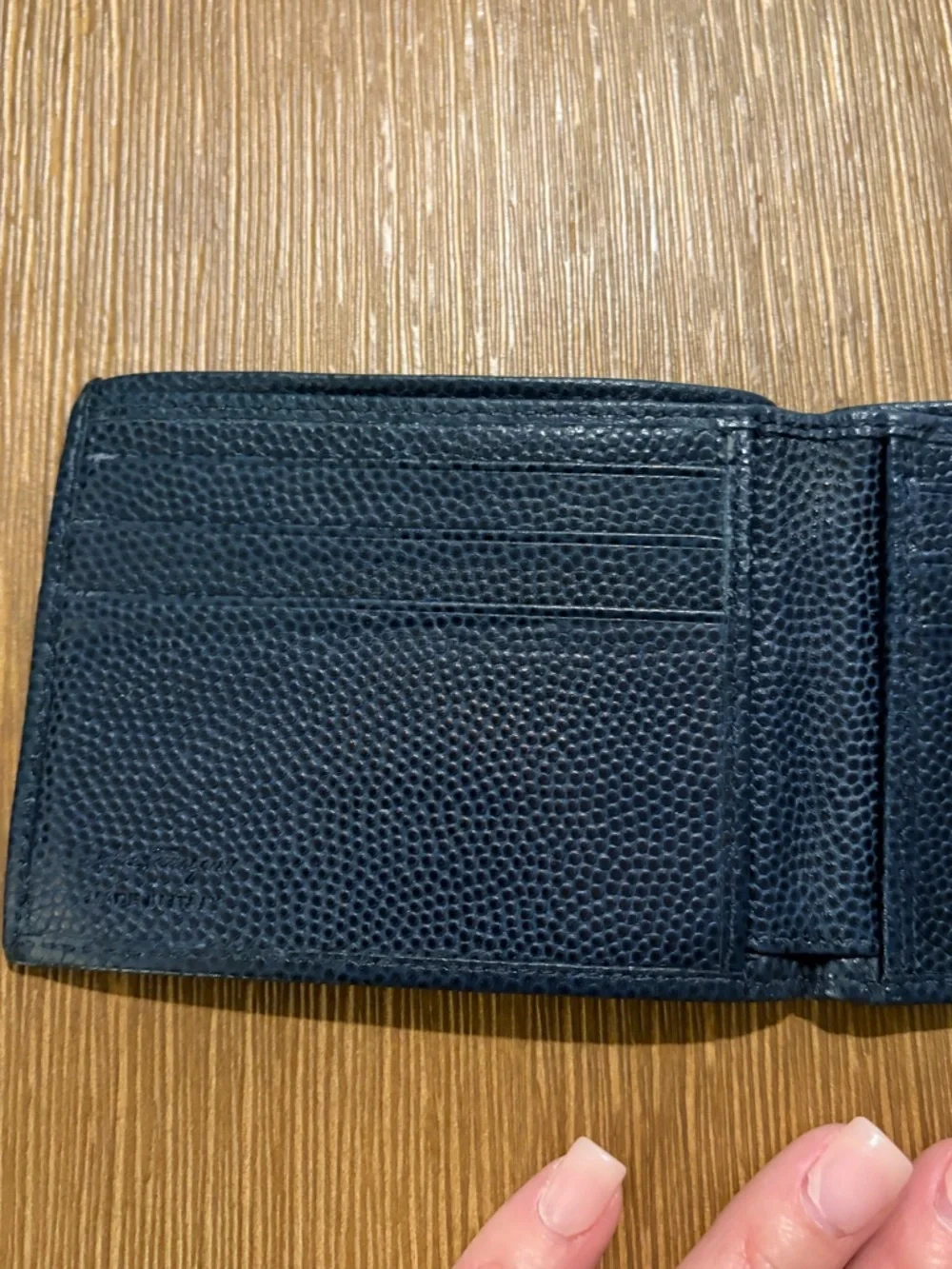 Salvatore Ferragamo men's textured leather bifold wallet with Gancini logo